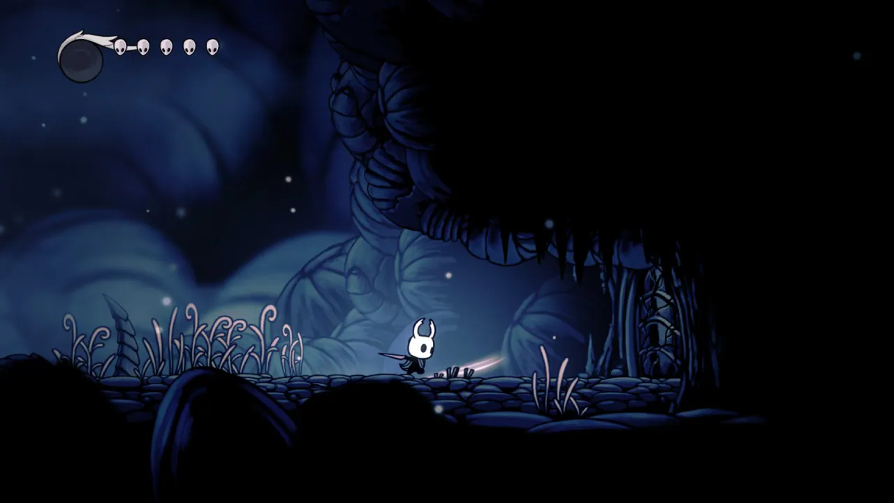 Hollow Knight gameplay in King's Pass, the Knight mid nail-swing, rendered by Ferrum on an Apple M5
