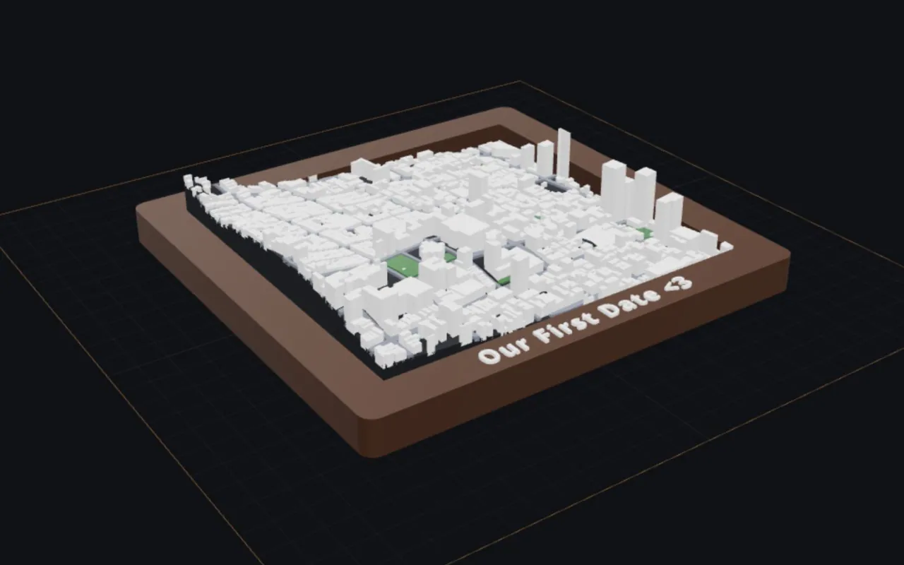 A BambiMaps model of Nob Hill, San Francisco on a build plate: white buildings over real terrain in a walnut frame with “Our First Date <3” raised on the rail