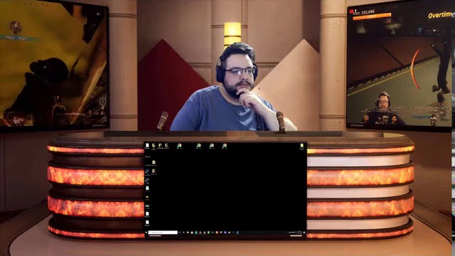 Mike at the flame-panel desk of the 2020 virtual studio set